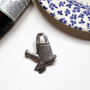 Unbranded pewter water can pin brooch